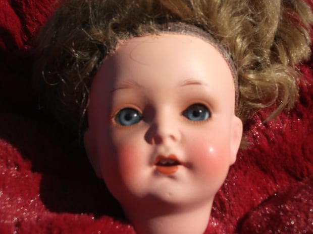 porcelain doll head repaired by Karen Dean / ceramic restoration studios